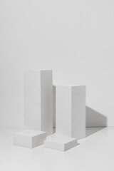 Cube Pedestal Template. White square podiums with shadow on white background