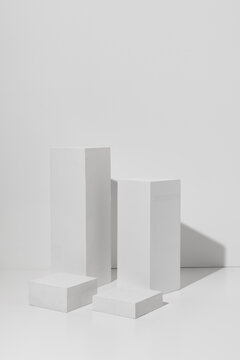 Cube Pedestal Template. White square podiums with shadow on white background © Bojanikus