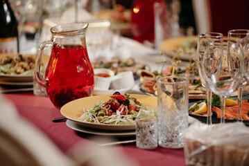 Preparing the dining table for the solemn event.