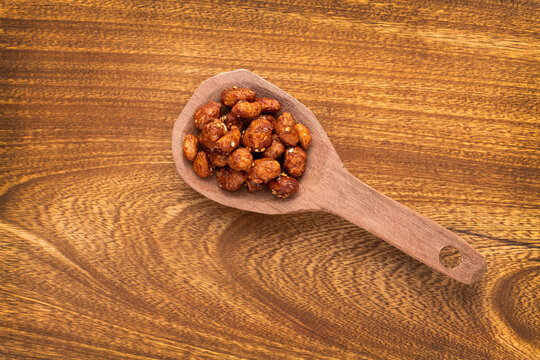 roasted praline peanuts with white sesame seeds - Arachis hypogaea