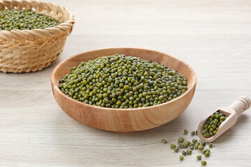 Green mung beans served on wooden bowl. Food ingredient