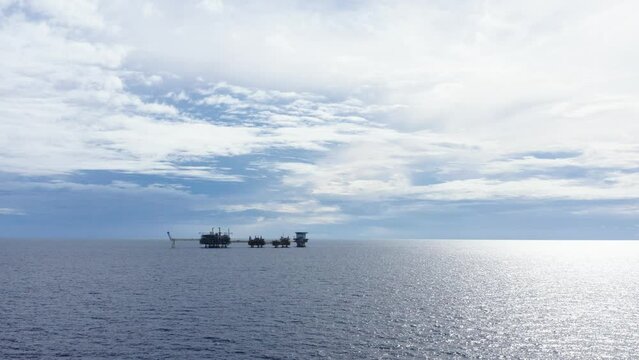 Central processing platform (cpp) in the middle of the ocean on cloudy day - upstream industry
