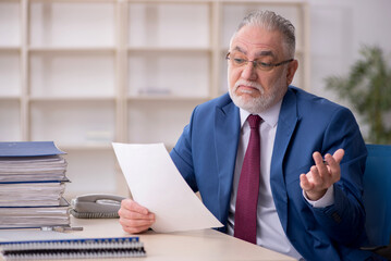 Old male employee and too much work at workplace