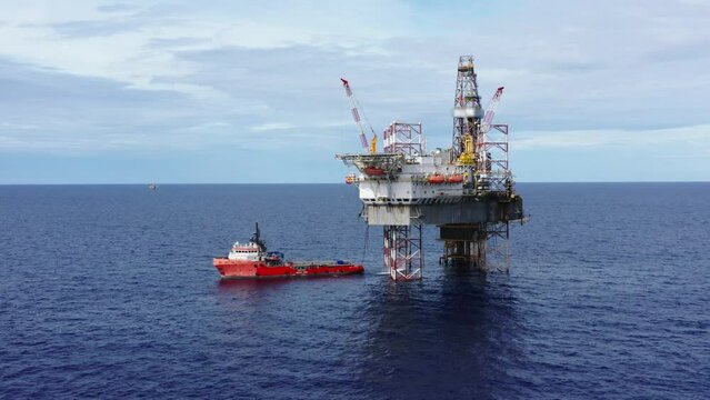 Aerial view from a drone of an offshore jack up rig at the offshore location during day time
