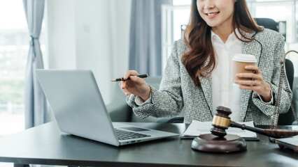 Video call consult on laptop computer, Online consulting with laptop in office of asian thai japanese chinese female exclusive lawyer legal advisor, legislation, saleswoman, legal contract documents