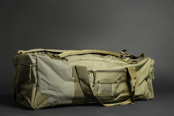 Army bag on dark grey background. Military equipment