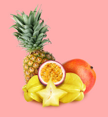 Many different fresh fruits on light pink background