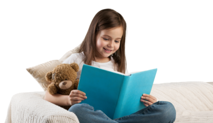 Cute child girl reading a book in bed before going to sleep