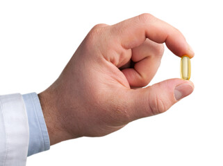 Fototapeta premium Fish oil pill in hand isolated on white