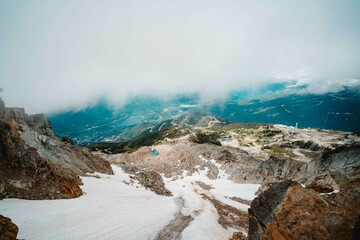 beautiful snowy and foggy lookout from top of mountain into nature valley