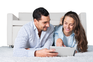 Young couple using tablet isolated on white background