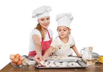 Portrait of adorable little girl and her mother baking together