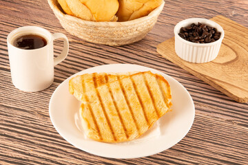 Delicious toasted bread with melted butter, Brazilian breakfast
