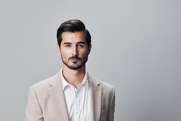 man businessman happy crossed business suit copyspace beige smiling handsome portrait