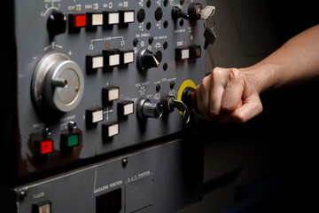 Press the emergency button on cnc machine control panel at factory,concept of prevention before damage of CNC machines