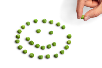 Fresh appetizing pea with green leaf