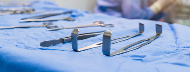 Medical or surgical instrument or tools on blue table inside operating room in hospital.Surgeon...