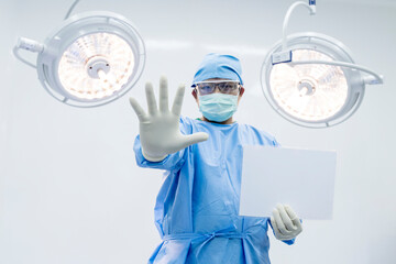 Asian surgeon or doctor did prohibit position inside operating room in hospital.People holding...