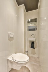 a white bathroom with a toilet and mirror in the shower stall, it appears to be used as a public restroom