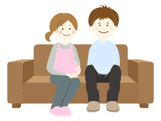 ソファーに座る妊娠中の妻と夫
