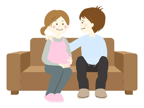 ソファーに座る妊娠中の妻と夫