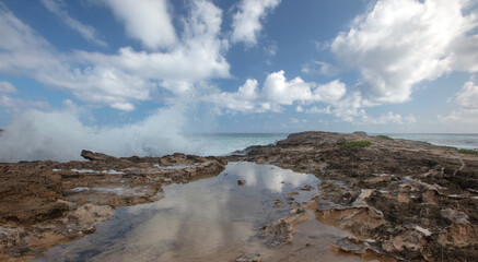 Spray from storm waves crashing into Laie Point coastline at Kaawa on the North Shore of Oahu Hawaii United States