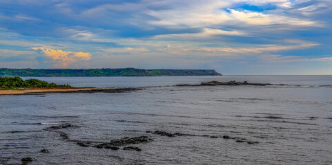 Magnificent bay, beautiful cape, vast view and scenic sky,pleasant cloudscape. Xiyu,Penghu,Taiwan,for branding,calender,postcard,screensave,wallpaper,poster,banner,cover,website.High quality photo