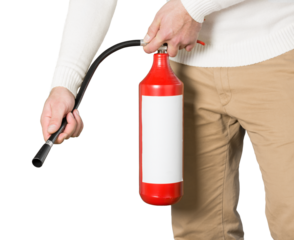 Man using fire extinguisher against grey background