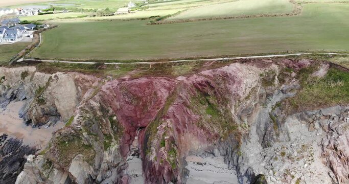 Aerial Dolly View Across Dramatic Eroded Cliffs At Thurlestone