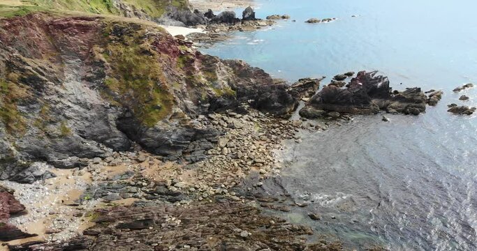 Slow Aerial Pan Up View Across Thurlestone Coastline In South Devon. Establishing Shot
