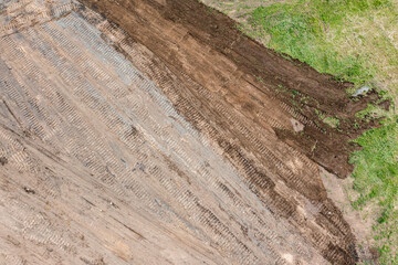 flattening ground on construction site. construction background. aerial top view.