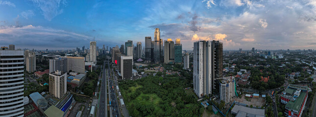 Fototapeta premium aerial shoot of Jakarta skyline during the golden hour. Jakarta is the capital city of indonesia that also one of the most populated city in the world.