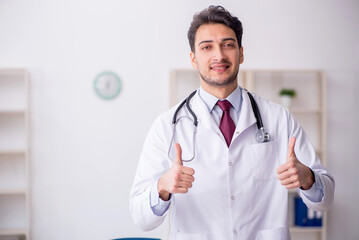 Young male doctor working at the hospital