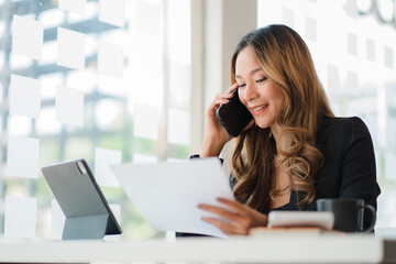 Businesswoman working at office with laptop computer on table Asian female accountant or banker...