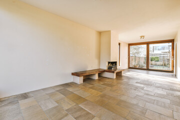 an empty living room with wood flooring and white walls that have been stripped down to make it...