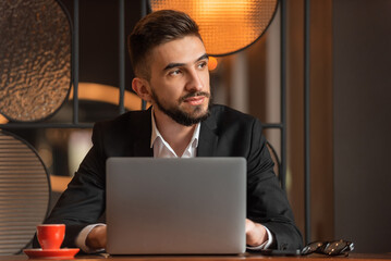 A young business man working in the office.
