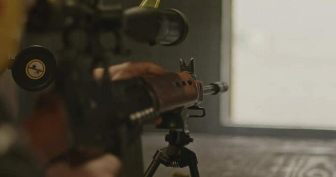 Sniper aiming FN FAL Combat Rifle and shooting in slow motion