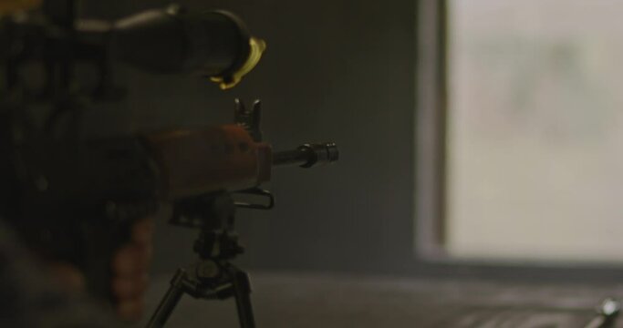 Close up of FN FAL combat rifle firing in slow motion