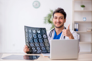 Young male doctor radiologist working in the clinic