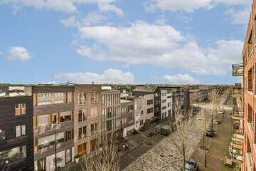 Fototapeta premium an urban area with buildings and cars parked on the street in front of them, as seen from a high angle