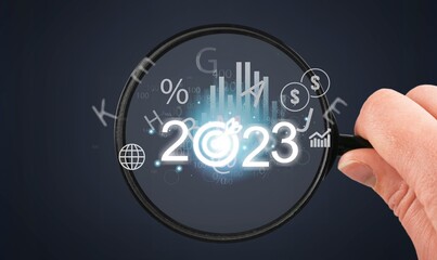 2023 concept, business person hold numbers with target
