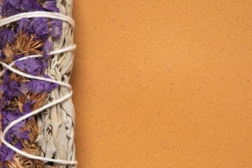 Purple flowers and sage smudge stick