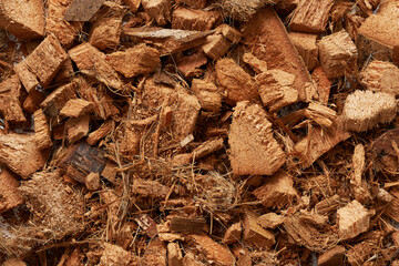 top view flat lay pile of coco fluff or coconut husk chip texture background. close up coco fluff or coconut husk chip texture background. coco fluff or coconut husk chip texture