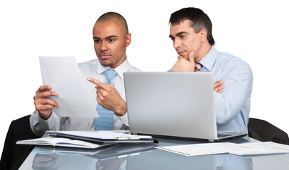 Business men using laptop while making report in office
