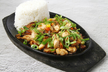Freshly Photo of freshly made Filipino food called Chicken salpicao served in a hot plate