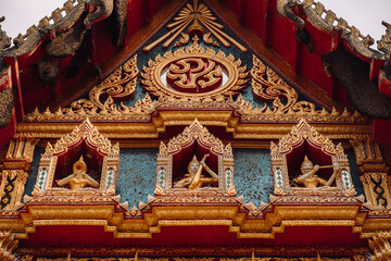 Naklejka premium Buddhism Religion Golden Temple Image Sough-East Asian Praying Statue