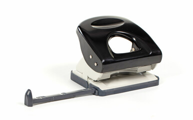 Black office puncher over white background