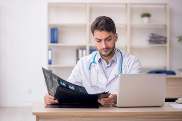 Young male doctor radiologist working in the clinic