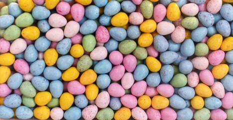 Lots of colorful candies in the shape of eggs