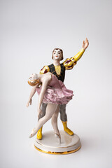 Porcelain figurine, a pair of dancing ballerinas on a white background.